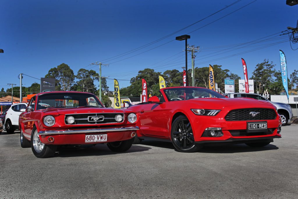 (left) Steve Dunsmuir's 1965 Ford Mustang GT Coupe with the new 2016 Ford Mustang at Pacific Ford, Maroochydore. Photo: Iain Curry / Sunshine Coast Daily (left) Steve Dunsmuir's 1965 Ford Mustang GT Coupe with the new 2016 Ford Mustang at Pacific Ford, Maroochydore. Photo: Iain Curry / Sunshine Coast Daily