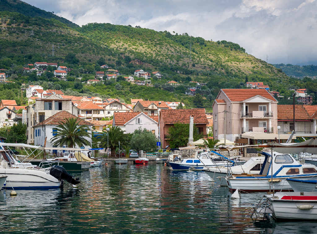Traditional boats at a fishing village in Montenegro. Traditional boats at a fishing village in Montenegro.