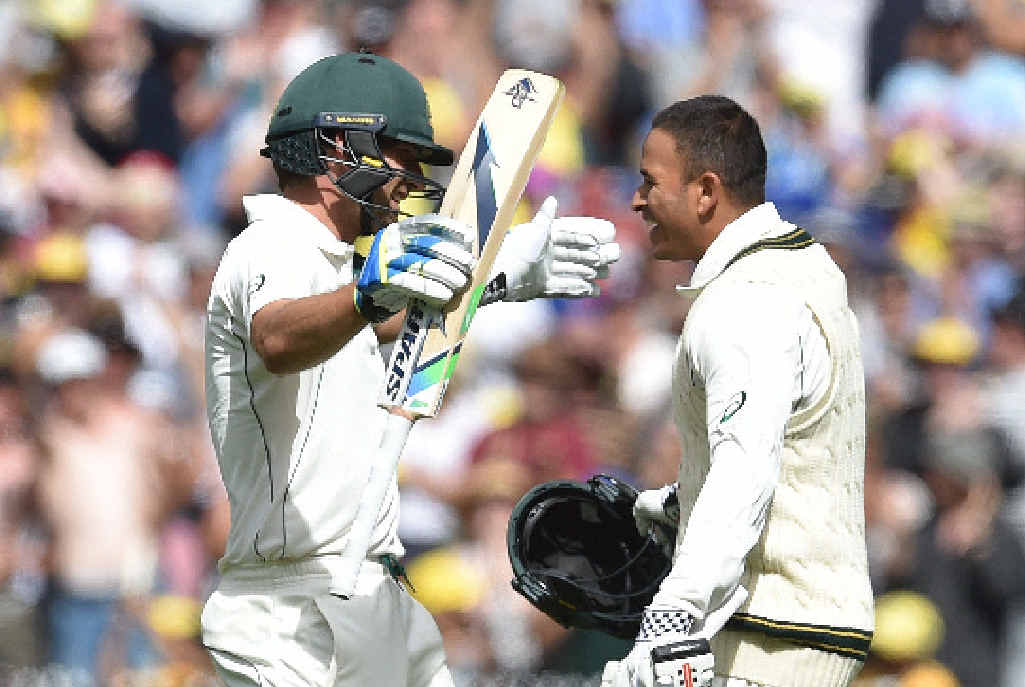 WINDIES A WALKOVER: Century-makers Joe Burns and Usman Khawaja celebrate their achievements on the opening day of the Boxing Day Test in Melbourne. WINDIES A WALKOVER: Century-makers Joe Burns and Usman Khawaja celebrate their achievements on the opening day of the Boxing Day Test in Melbourne.