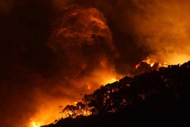 A supplied image obtained, Saturday, Dec. 26, 2015 of a bushfire at Wye River near Lorne south of in Melbourne. Fires yesterday destroyed 53 houses in the Otway Ranges. A supplied image obtained, Saturday, Dec. 26, 2015 of a bushfire at Wye River near Lorne south of in Melbourne. Fires yesterday destroyed 53 houses in the Otway Ranges.