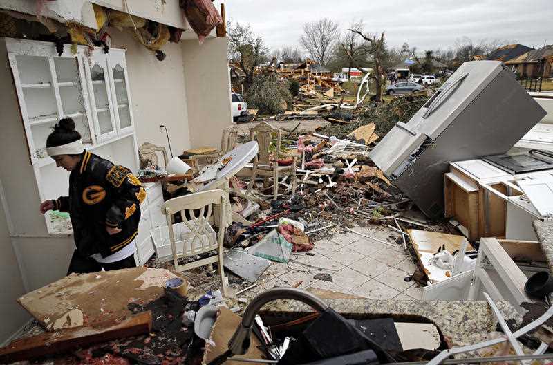 Residents surveyed the destruction from deadly tornadoes in North Texas as the same storm system brought winter woes to the Midwest on Monday, amplifying flooding that's blamed for more than a dozen deaths and prompting hundreds of flight cancellations. Residents surveyed the destruction from deadly tornadoes in North Texas as the same storm system brought winter woes to the Midwest on Monday, amplifying flooding that's blamed for more than a dozen deaths and prompting hundreds of flight cancellations.