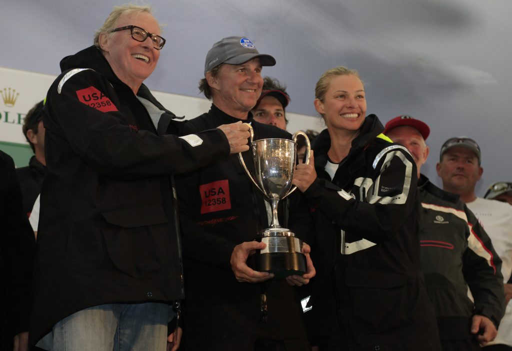 Comanche joint owner Jim Clarke, skipper Ken Read and Kristy Hinze-Clark celebrate at the race finish in Hobart. Comanche joint owner Jim Clarke, skipper Ken Read and Kristy Hinze-Clark celebrate at the race finish in Hobart.