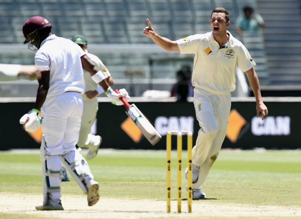 Australia's Josh Hazlewood, right celebrates the wicket but was given not out off a no ball of West Indies' Darren Bravo, left during their cricket test match in Melbourne. Australia's Josh Hazlewood, right celebrates the wicket but was given not out off a no ball of West Indies' Darren Bravo, left during their cricket test match in Melbourne.