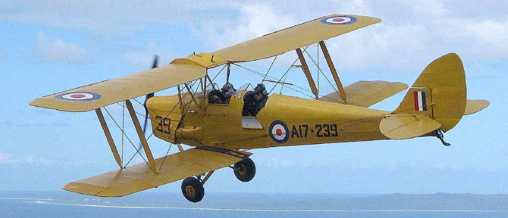 FLYING HIGH: Pilot Nick Maylor takes his beloved Tiger Moth on a joy flight over Moreton Bay. FLYING HIGH: Pilot Nick Maylor takes his beloved Tiger Moth on a joy flight over Moreton Bay.