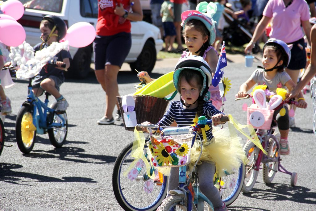 Children decorate their bikes for the Easter parade. Children decorate their bikes for the Easter parade.