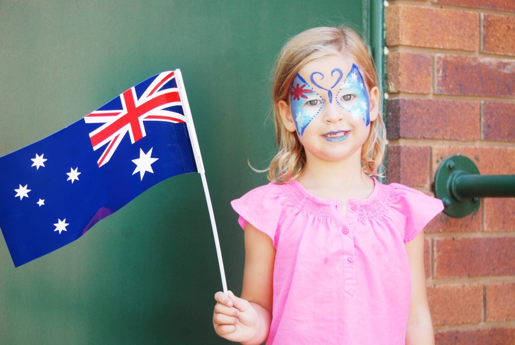 Shaylah Ireland waves her Australia Day flag with pride. Shaylah Ireland waves her Australia Day flag with pride.