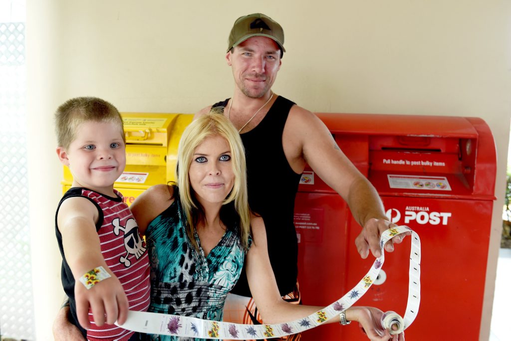 $1 letters - Kawungan's James Hansen, Tatyana Arnold and four year old Dommonik Arnold with the newly issued one dollar stamps. Photo: Valerie Horton / Fraser Coast Chronicle $1 letters - Kawungan's James Hansen, Tatyana Arnold and four year old Dommonik Arnold with the newly issued one dollar stamps. Photo: Valerie Horton / Fraser Coast Chronicle
