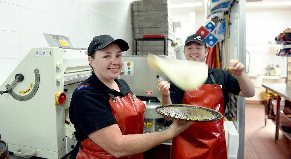 Domino’s store Manager Sharnay Conlon and Beau Bennett hard at work ahead of the second store opening. INSET: Construction of the store is underway. Domino’s store Manager Sharnay Conlon and Beau Bennett hard at work ahead of the second store opening. INSET: Construction of the store is underway.