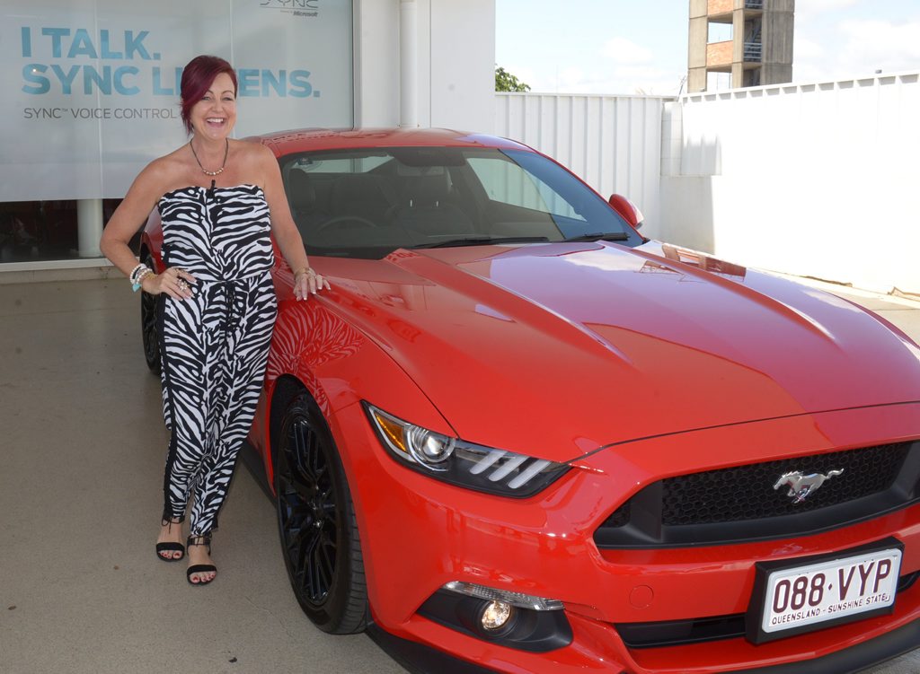 VERY EXCITED: Kylie Johnson takes delivery of her new Ford GT V8 Mustang from Coral Coast Ford. Photo: Mike Knott / NewsMail VERY EXCITED: Kylie Johnson takes delivery of her new Ford GT V8 Mustang from Coral Coast Ford. Photo: Mike Knott / NewsMail