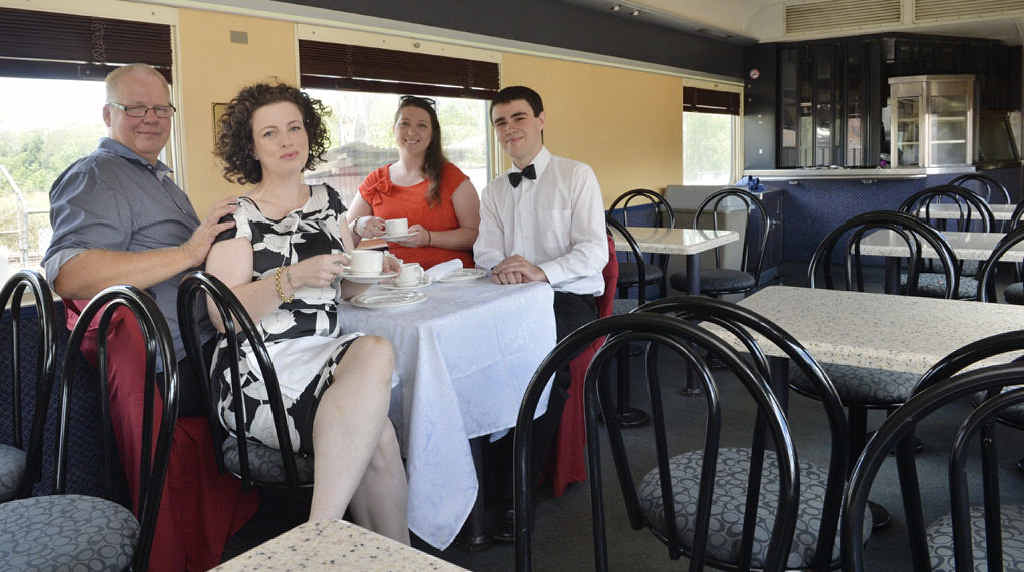 SALVATION: In one of the QR donated carriages are (from left) Patrick Hughes and Miriam Slattery along with Sam and Donald Behan.