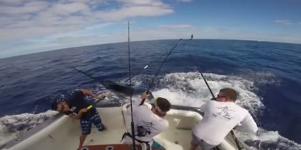 The man quickly jumped out of the way as the marlin came on board. Photo / Facebook The man quickly jumped out of the way as the marlin came on board. Photo / Facebook