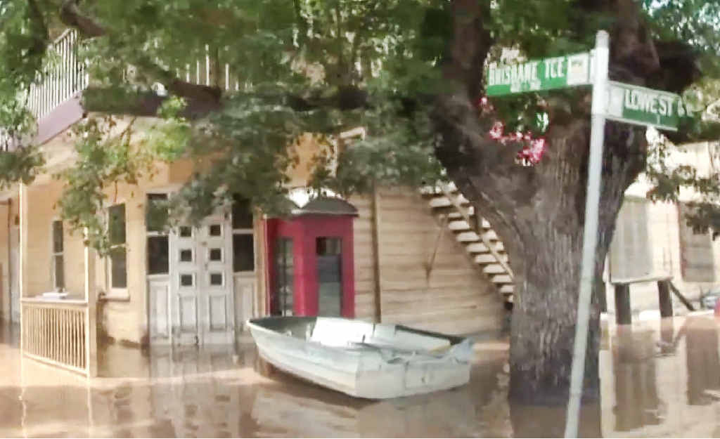 A boat parks outside the Royal Mail Hotel during the 2011 floods. ABOVE: A muddy mess outside the pub. A boat parks outside the Royal Mail Hotel during the 2011 floods. ABOVE: A muddy mess outside the pub.