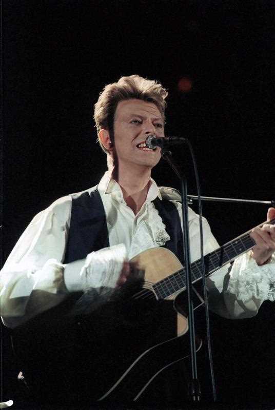 David Bowie performing during his concert in a stadium in Budapest, Hungary. Bowie died on 10 January 2016, at the age of 69, after a battle with cancer. David Bowie performing during his concert in a stadium in Budapest, Hungary. Bowie died on 10 January 2016, at the age of 69, after a battle with cancer.