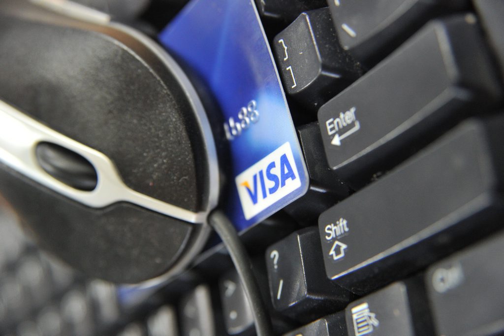 Feature picture of a Visa card, computer mouse and keyboard.Picture: DERRICK DEN HOLLANDER scam130110- Feature picture of a Visa card, computer mouse and keyboard.Picture: DERRICK DEN HOLLANDER scam130110-