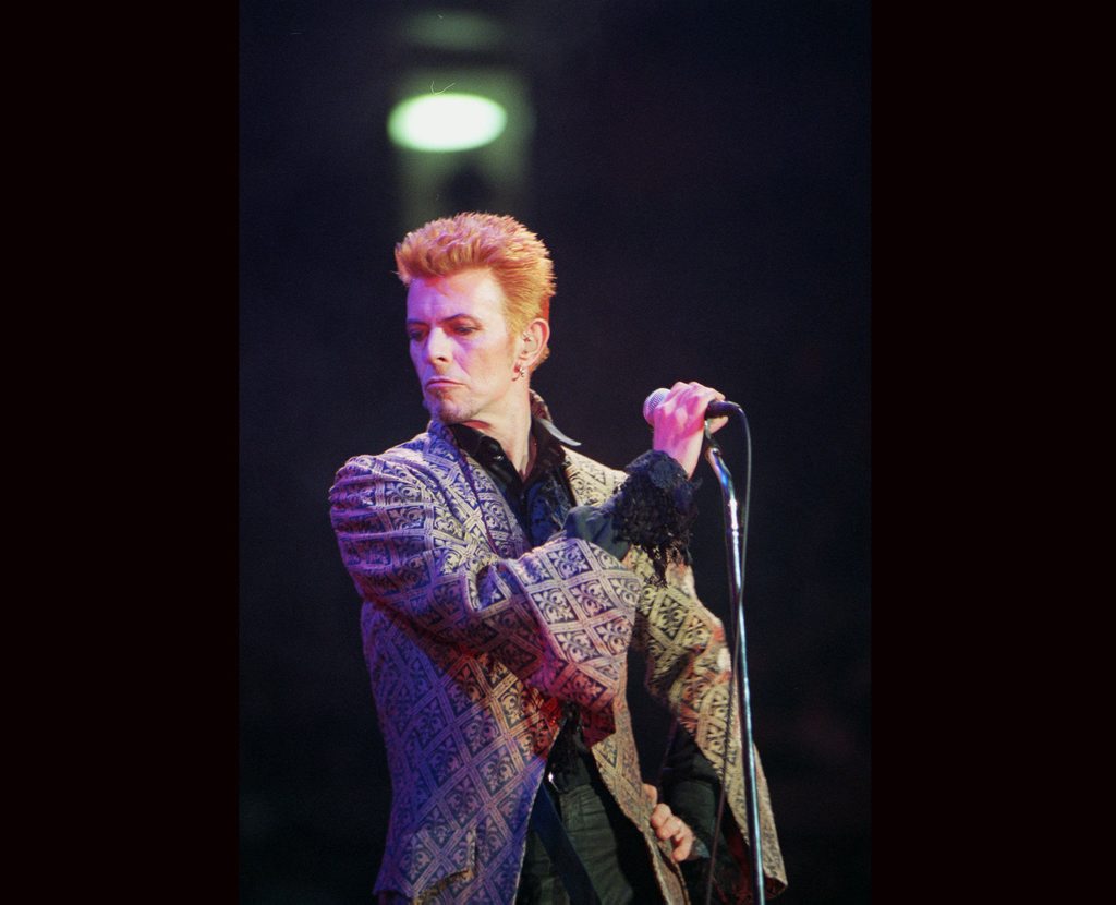FILE - In this Jan. 9, 1997, file photo, David Bowie performs during a concert celebrating his 50th birthday, at Madison Square Garden in New York. Bowie, the innovative and iconic singer whose illustrious career lasted five decades, died Monday, Jan. 11, 2016, after battling cancer for 18 months. He was 69. (AP Photo/Ron Frehm, File) FILE - In this Jan. 9, 1997, file photo, David Bowie performs during a concert celebrating his 50th birthday, at Madison Square Garden in New York. Bowie, the innovative and iconic singer whose illustrious career lasted five decades, died Monday, Jan. 11, 2016, after battling cancer for 18 months. He was 69. (AP Photo/Ron Frehm, File)