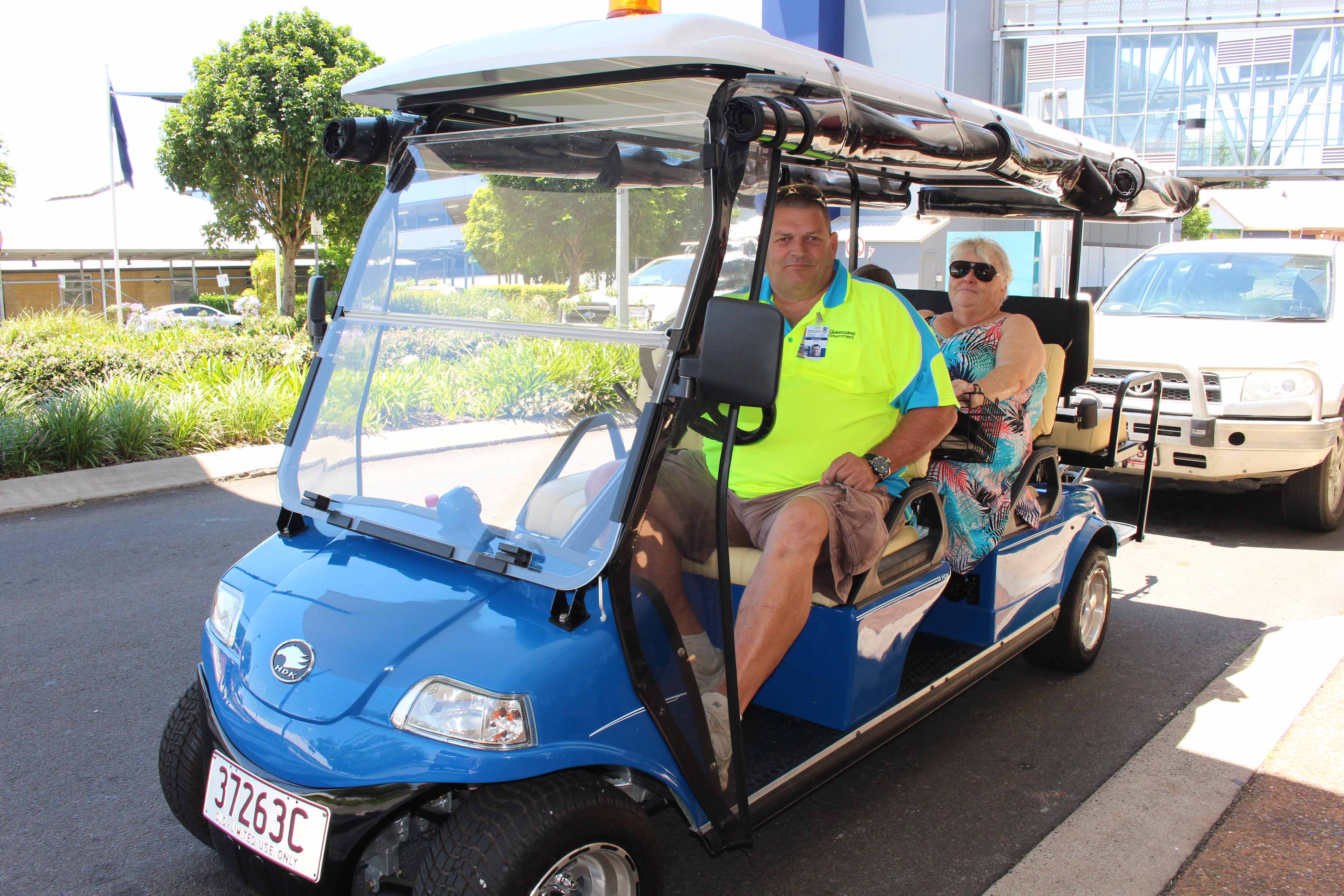 Mrs Gail McCaffery was one of the first passengers in Toowoomba Hospital’s new patient-transport buggy. The driver is Toowoomba Hospital volunteer Brett Torcetti. Mrs Gail McCaffery was one of the first passengers in Toowoomba Hospital’s new patient-transport buggy. The driver is Toowoomba Hospital volunteer Brett Torcetti.