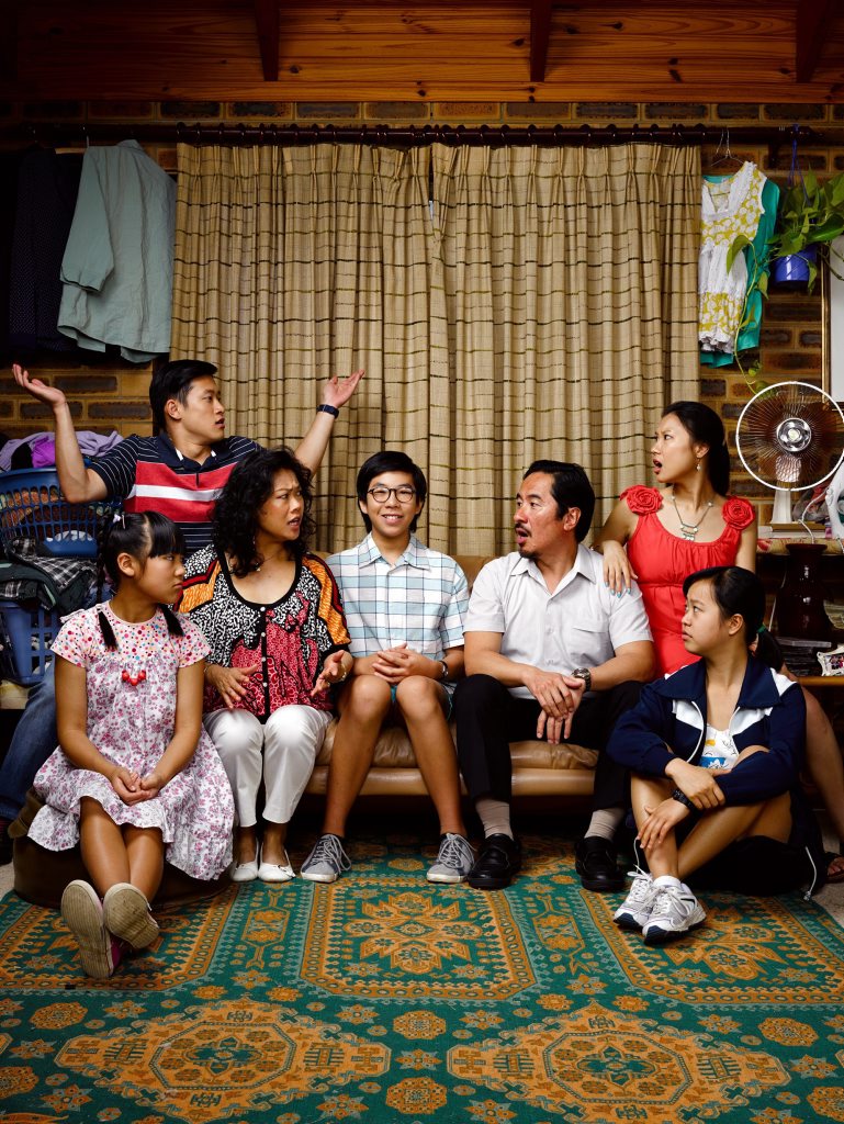 Trystan Go, centre, stars as Benjamin Law in the TV series The Family Law. Trystan Go, centre, stars as Benjamin Law in the TV series The Family Law.