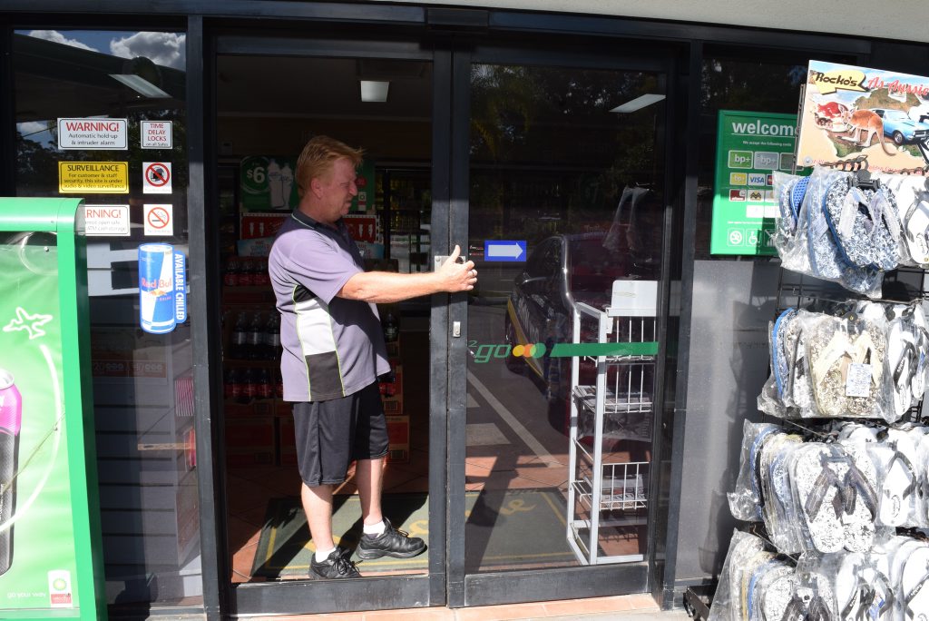 BP Tanawha console operator David Jones inspects damage to a front glass sliding door caused by thieves. BP Tanawha console operator David Jones inspects damage to a front glass sliding door caused by thieves.
