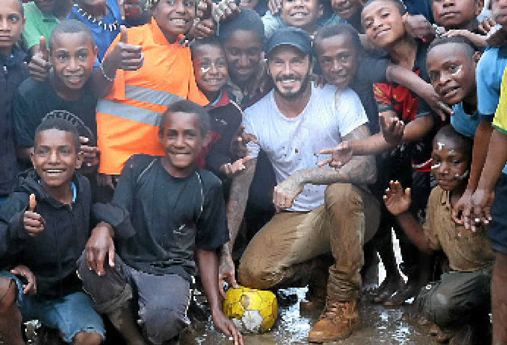 David Beckham with local children in Kumnga Village in the Western Highlands Province of Papua New Guinea. David Beckham with local children in Kumnga Village in the Western Highlands Province of Papua New Guinea.