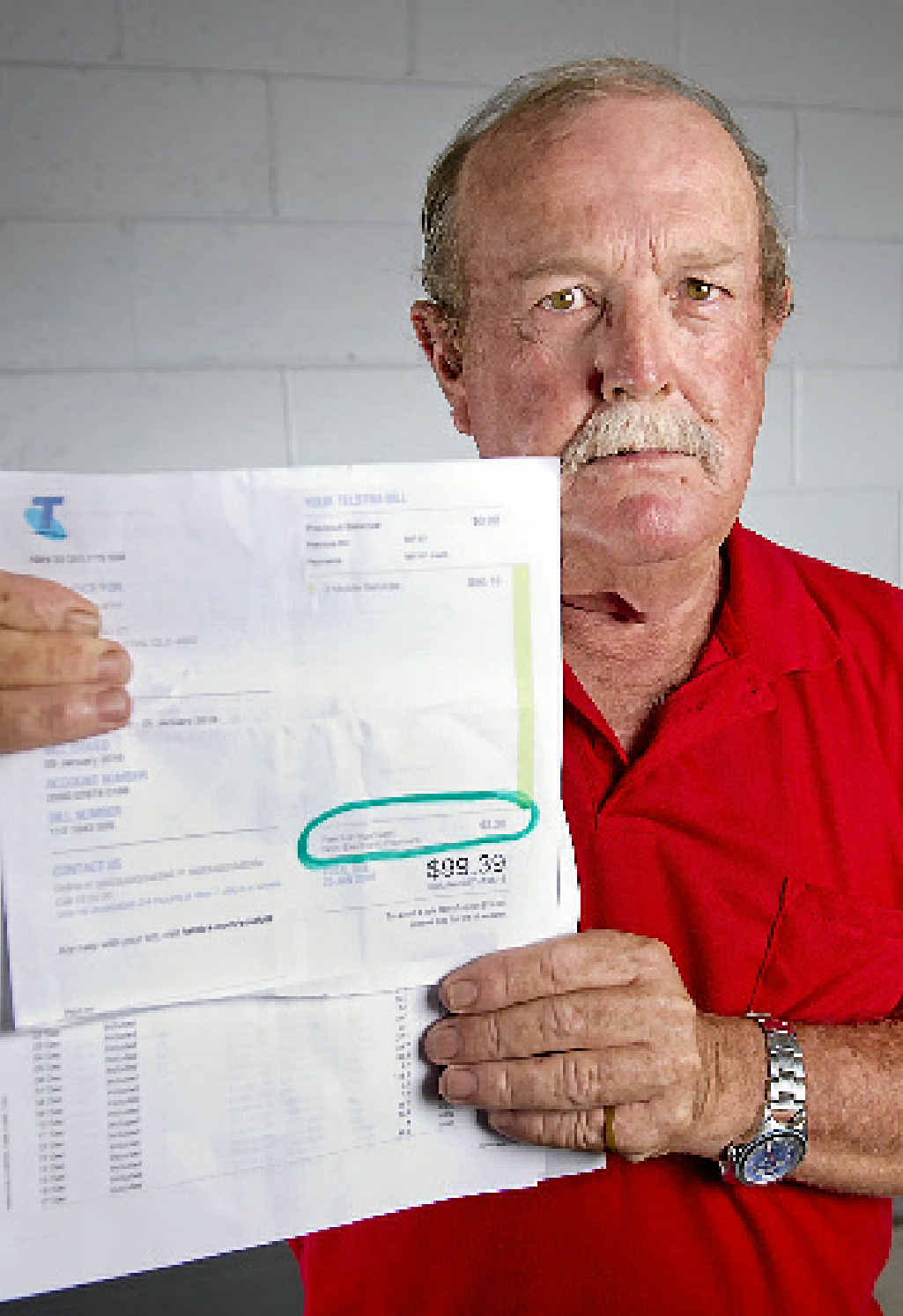 FEE FIGHTER: Kerry Smith doesn’t understand why he has to pay $3.20 to pay his monthly Telstra bill in the Telstra store. FEE FIGHTER: Kerry Smith doesn’t understand why he has to pay $3.20 to pay his monthly Telstra bill in the Telstra store.