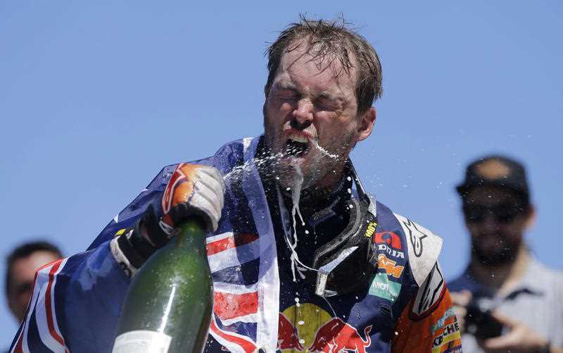 Australian motorbike rider Toby Price, of the Red Bull KTM Factory Team, sprays sparkling wine into his mouth after winning the 2016 Dakar Rally, in Rosario, Argentina, Saturday, Jan. 16, 2016. Price became the first Australian winner of the motorbikes class, almost 40 minutes ahead of KTM teammate Stefan Svitko of Slovakia. Australian motorbike rider Toby Price, of the Red Bull KTM Factory Team, sprays sparkling wine into his mouth after winning the 2016 Dakar Rally, in Rosario, Argentina, Saturday, Jan. 16, 2016. Price became the first Australian winner of the motorbikes class, almost 40 minutes ahead of KTM teammate Stefan Svitko of Slovakia.