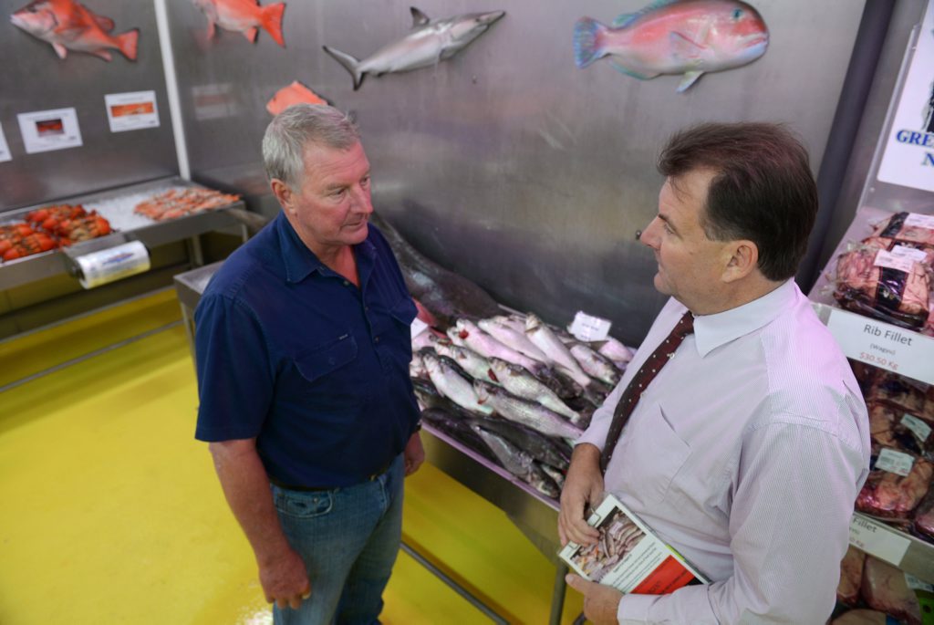 SIGN UP: Grunske's owner Peter Grunske and Member for Burnett Stephen Bennett encourage the community to get behind the petition to oppose the governments proposed net fishing ban along the Queensland coast. Photo: Max Fleet / NewsMail