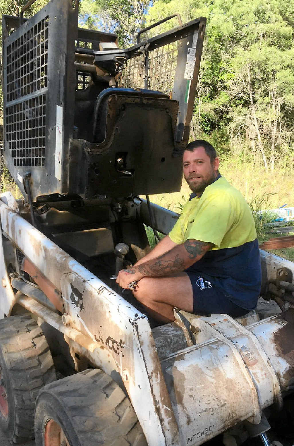 HARD WORKER: Unemployed Gympie man Tim Boyle proved himself to be a hard worker at Anderleigh Quarry yesterday when he was given the chance after waiting on the road this week, ready to work and holding an ‘I need work’ sign (inset). HARD WORKER: Unemployed Gympie man Tim Boyle proved himself to be a hard worker at Anderleigh Quarry yesterday when he was given the chance after waiting on the road this week, ready to work and holding an ‘I need work’ sign (inset).