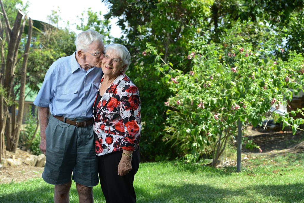 Joyce Rieck receives congratulations from husband Arnold after she was announced as an OAM recipient. Photo: Rob Williams / The Queensland Times