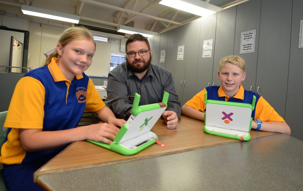 Briella Weber, Paul Corrin deputy principal and Codey Simpson using XO laptops at Mt Archer State School. Photo Allan Reinikka / The Morning Bulletin Briella Weber, Paul Corrin deputy principal and Codey Simpson using XO laptops at Mt Archer State School. Photo Allan Reinikka / The Morning Bulletin