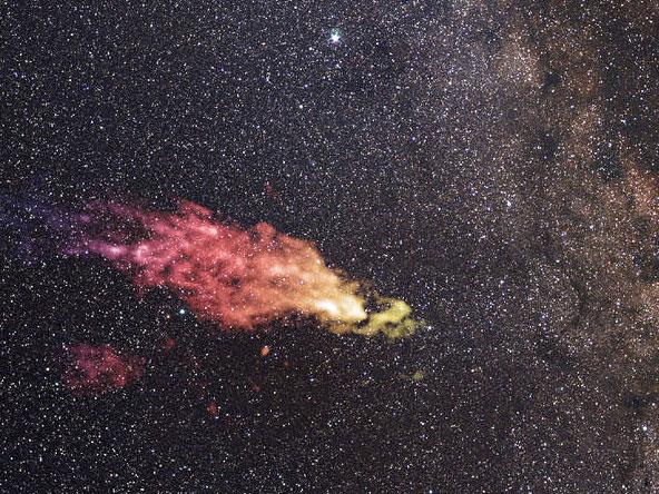 A composite image shows the Smith Cloud on the edges of the galaxy A composite image shows the Smith Cloud on the edges of the galaxy