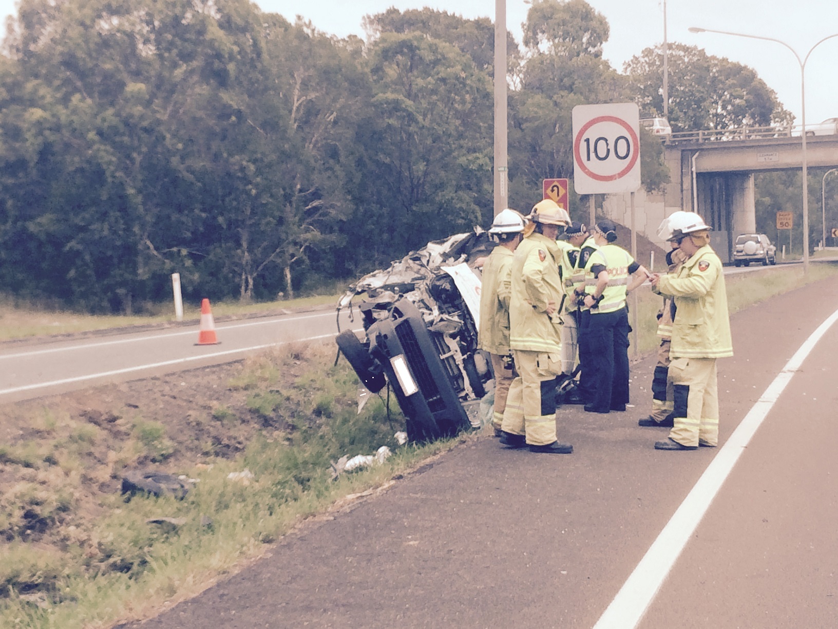 The scene on the Sunshine Motorway, Mooloolaba, where a vehicle has rolled. The scene on the Sunshine Motorway, Mooloolaba, where a vehicle has rolled.