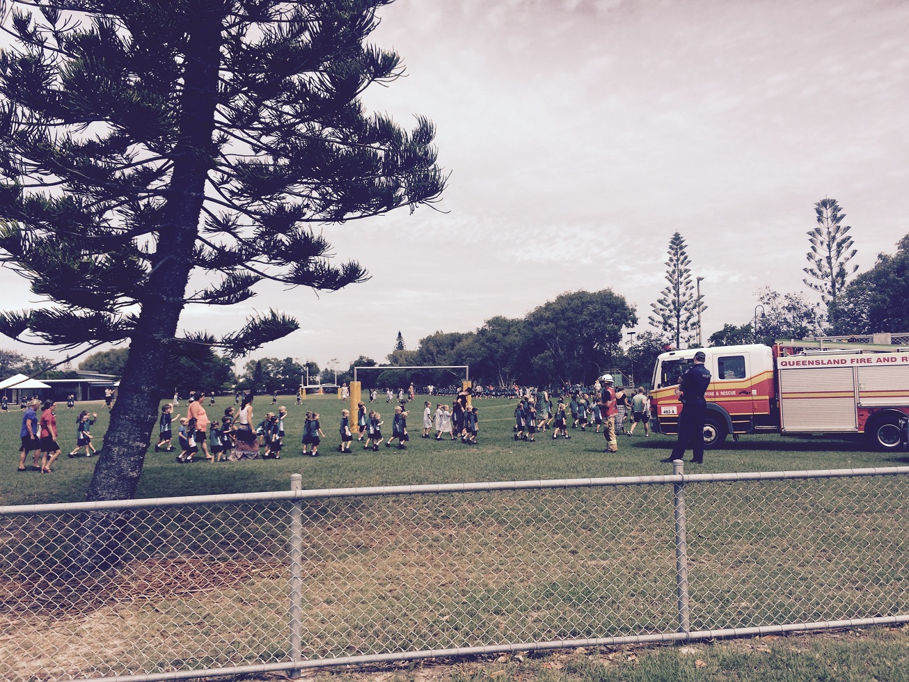 Students being moved from the school oval to the community hall during the Buddina Public School bomb scare. Students being moved from the school oval to the community hall during the Buddina Public School bomb scare.