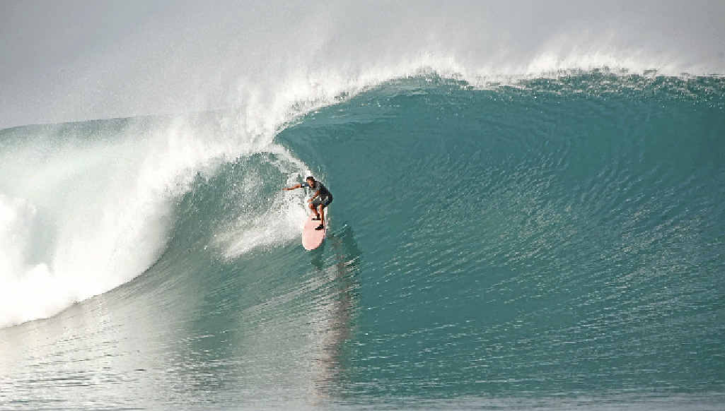 Felipe Pomar, aged 70, riding his home break on Rote, Indonesia. Felipe Pomar, aged 70, riding his home break on Rote, Indonesia.