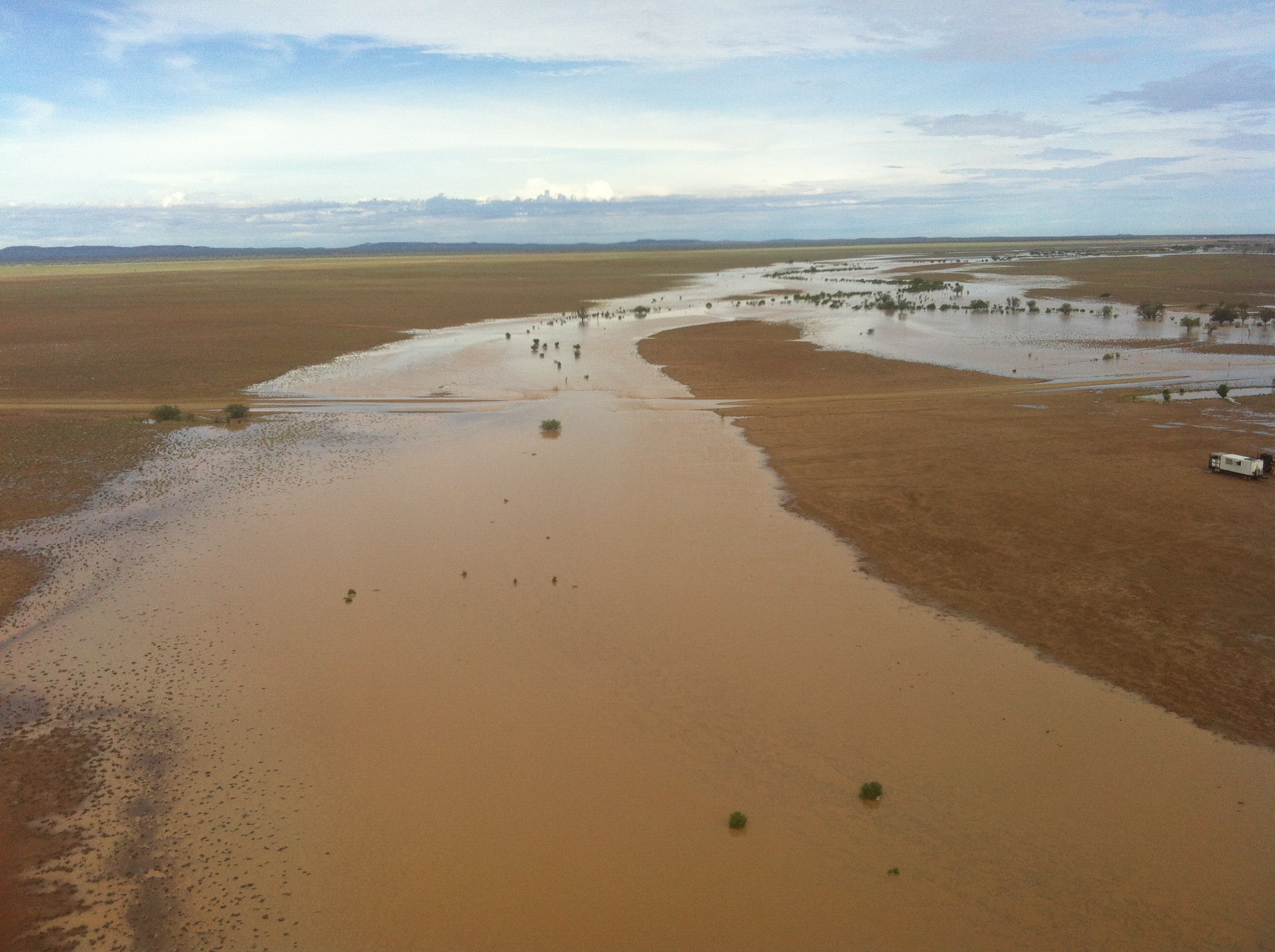 An Ergon field crew worker took the attached photos from one of nine flights ferrying temporary poles by helicopter yesterday. This was over a creek in the Stonehenge area flooding a local road and surrounding paddocks. An Ergon field crew worker took the attached photos from one of nine flights ferrying temporary poles by helicopter yesterday. This was over a creek in the Stonehenge area flooding a local road and surrounding paddocks.