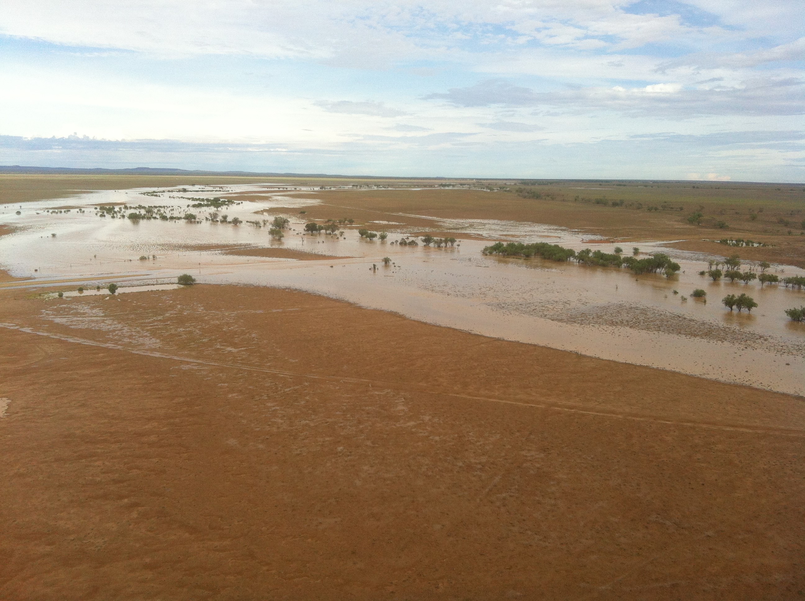 An Ergon field crew worker took the attached photos from one of nine flights ferrying temporary poles by helicopter yesterday. This was over a creek in the Stonehenge area flooding a local road and surrounding paddocks. An Ergon field crew worker took the attached photos from one of nine flights ferrying temporary poles by helicopter yesterday. This was over a creek in the Stonehenge area flooding a local road and surrounding paddocks.