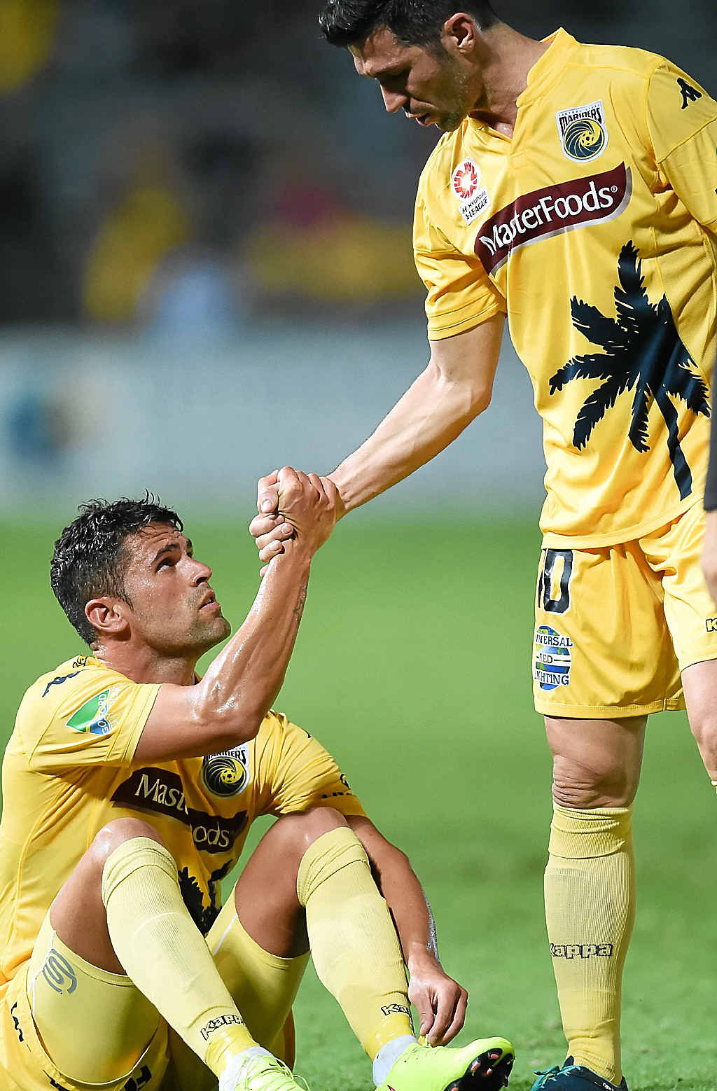 Helping hand ... Luis Garcia offers a hand to teammate Fabio Ferreira. Photo: AAP Image Helping hand ... Luis Garcia offers a hand to teammate Fabio Ferreira. Photo: AAP Image