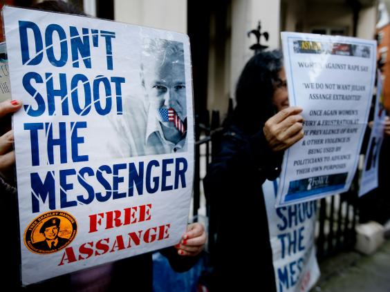 Demonstrators hold banners outside the Ecuadorean Embassy in London, where Wikileaks founder Julian Assange is staying. Demonstrators hold banners outside the Ecuadorean Embassy in London, where Wikileaks founder Julian Assange is staying.