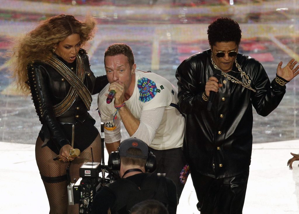 Coldplay singer Chris Martin performs with Beyonce and Bruno Mars during halftime of the NFL Super Bowl 50 football game in Santa Clara, Calif. Coldplay singer Chris Martin performs with Beyonce and Bruno Mars during halftime of the NFL Super Bowl 50 football game in Santa Clara, Calif.
