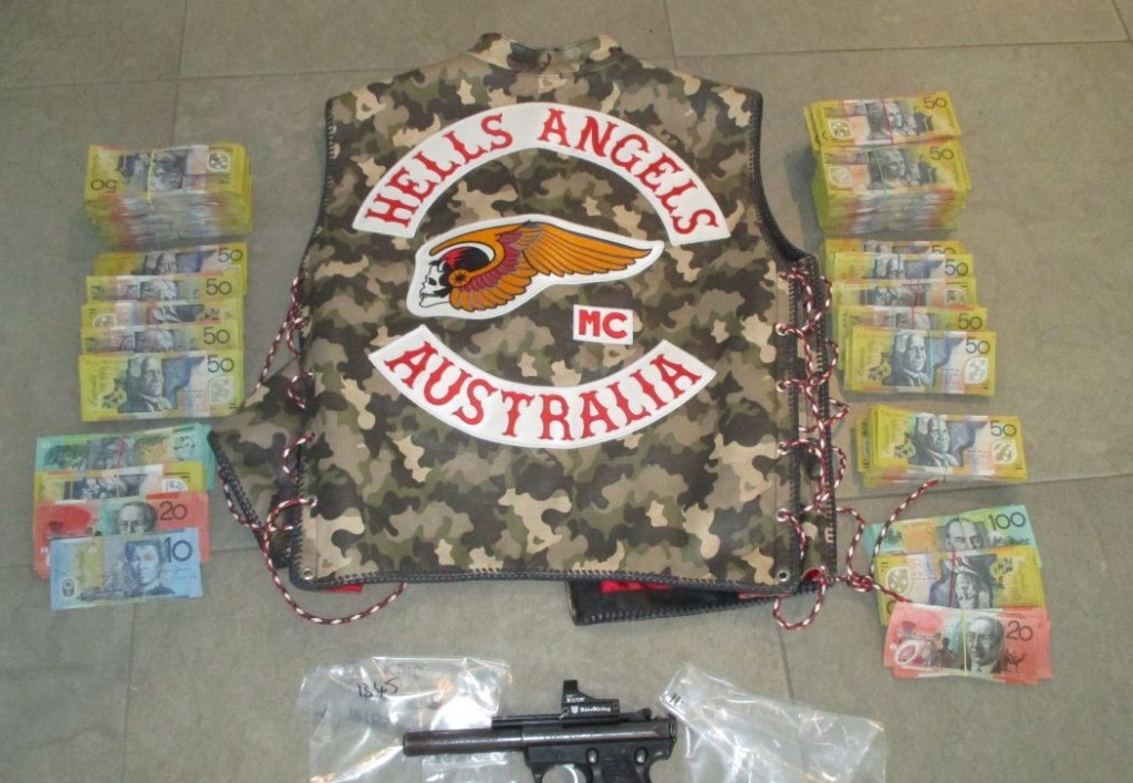 Police allegedly found $158,000 cash, a semi-automatic gun and drugs at the residence. Police allegedly found $158,000 cash, a semi-automatic gun and drugs at the residence.