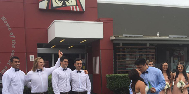 The picture of the happy couple in front of Colonel Sanders' face has gone viral.
The picture of the happy couple in front of Colonel Sanders' face has gone viral.