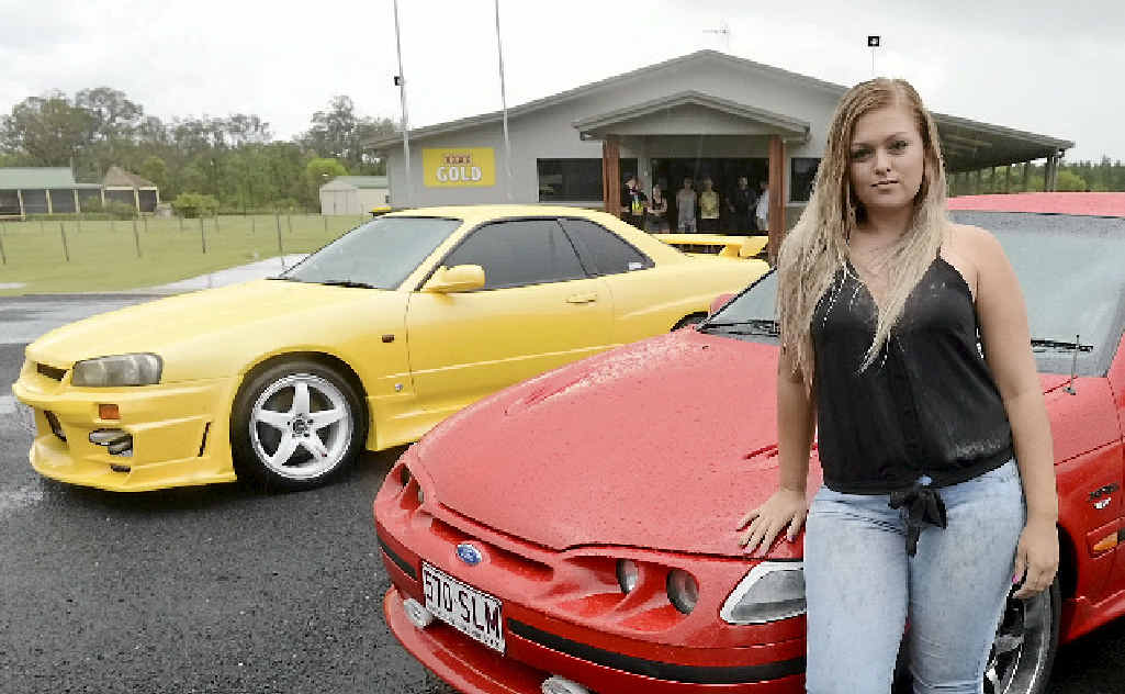 CAR ENTHUSIAST: Samantha Saywell poses with the cars at South Kolan. CAR ENTHUSIAST: Samantha Saywell poses with the cars at South Kolan.