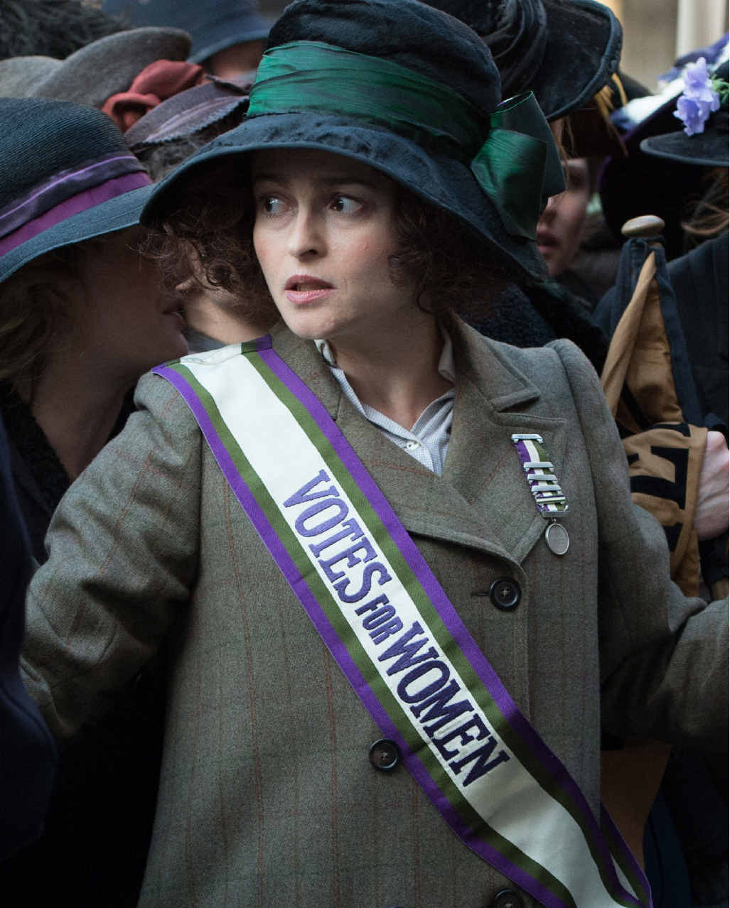 In this image released by Focus Features, Helena Bonham Carter portrays Edith Ellyn, center, in a scene from "Suffragette