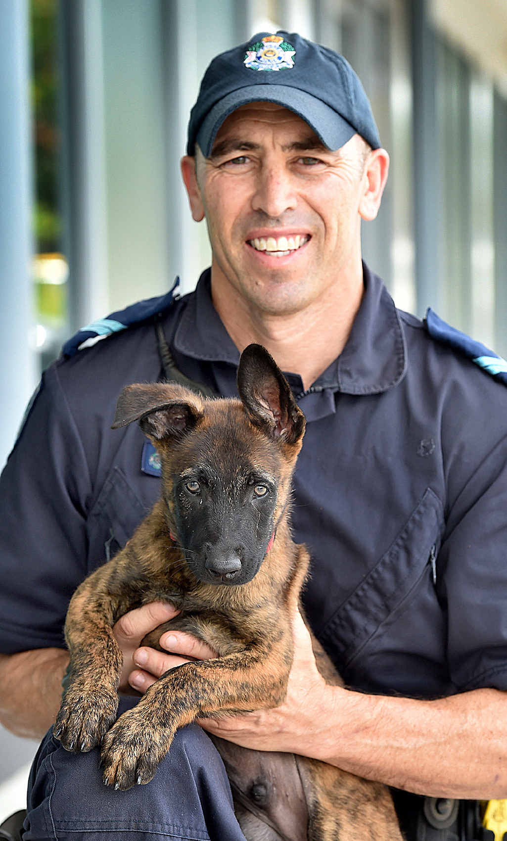 CUTE RECRUIT: New police dog recruit Castro with his handler Senior Constable Brendon Dellow. CUTE RECRUIT: New police dog recruit Castro with his handler Senior Constable Brendon Dellow.