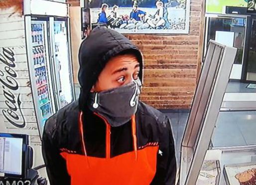 Police are searching for a man following an armed robbery of a business in Springwood on Wednesday night. Police are searching for a man following an armed robbery of a business in Springwood on Wednesday night.