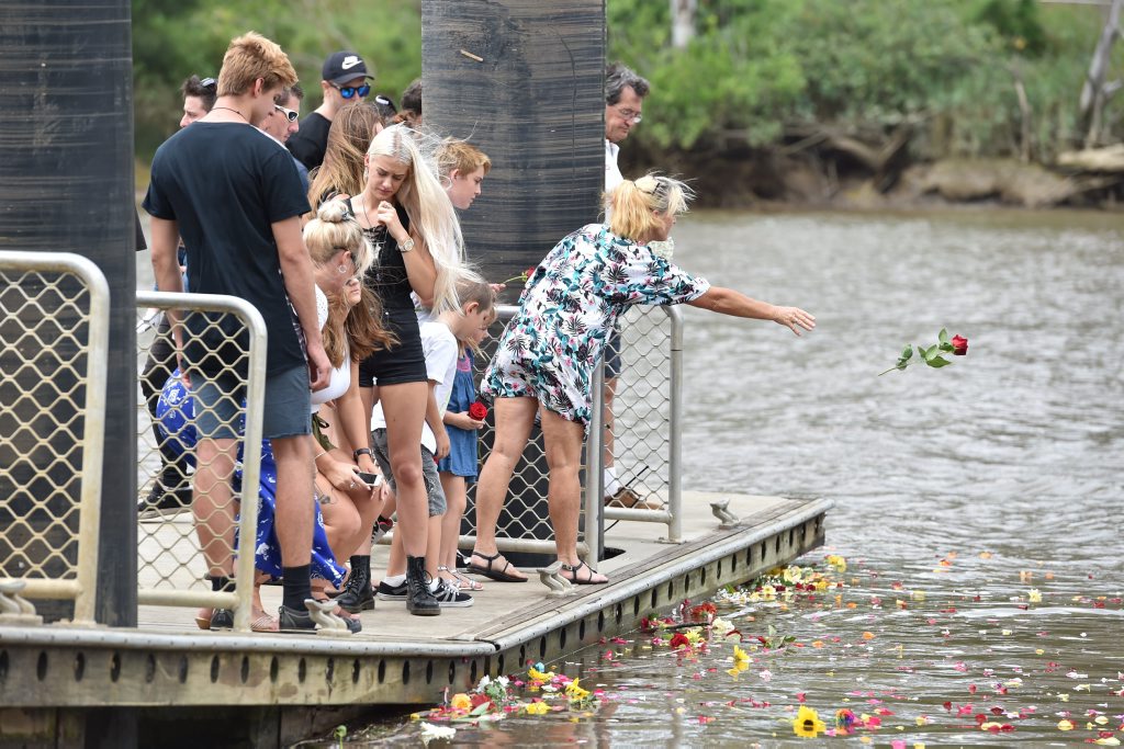 Memorial service for Joel Winterton at the park below the Lamington Bridge where he drowned. Friends farewell him with a floral tribute from the pontoon he was fishing from. Photo: Alistair Brightman / Fraser Coast Chronicle Memorial service for Joel Winterton at the park below the Lamington Bridge where he drowned. Friends farewell him with a floral tribute from the pontoon he was fishing from. Photo: Alistair Brightman / Fraser Coast Chronicle