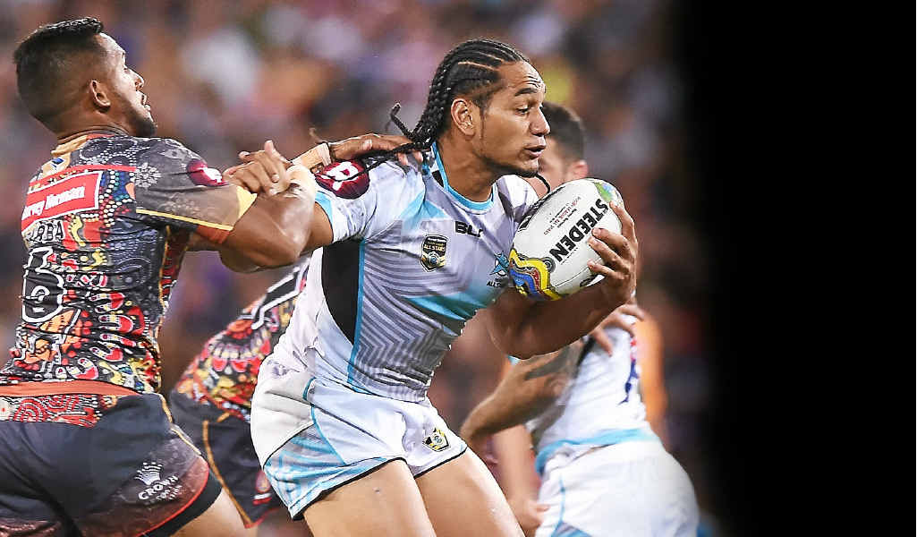 HOLDING ON: Martin Taupau is tackled by Ben Barba at Suncorp Stadium on Saturday. HOLDING ON: Martin Taupau is tackled by Ben Barba at Suncorp Stadium on Saturday.