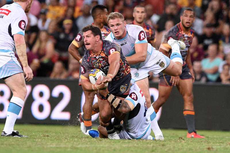 Greg Bird of the Indigenous All Stars (centre) is tackled by Tom Burgess of the World All Stars during their annual clash at Suncorp Stadium in Brisbane, Saturday, Feb. 13, 2016. Greg Bird of the Indigenous All Stars (centre) is tackled by Tom Burgess of the World All Stars during their annual clash at Suncorp Stadium in Brisbane, Saturday, Feb. 13, 2016.