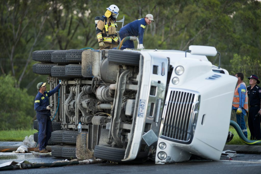 A fuel tanker carrying 30000 Litres of diesel which overturned at the roundabout of Gladstone Benaraby road has been drained successfully leaving clean-up crew the massive challenge of mopping up the spillage. Photo Paul Braven / The Observer A fuel tanker carrying 30000 Litres of diesel which overturned at the roundabout of Gladstone Benaraby road has been drained successfully leaving clean-up crew the massive challenge of mopping up the spillage. Photo Paul Braven / The Observer