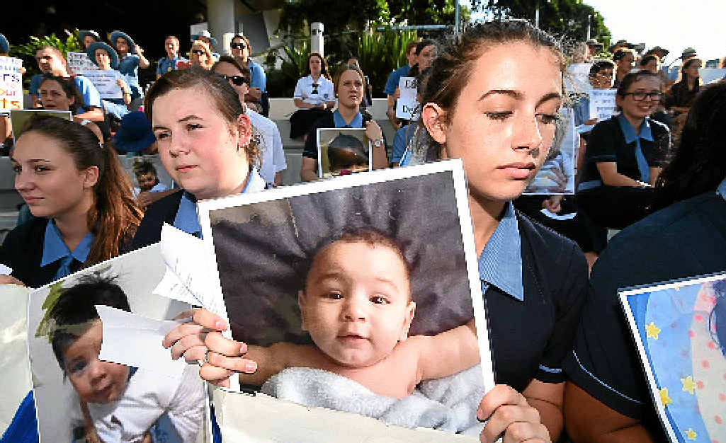 CAMPAIGN: Schoolchildren hold photos of Asha during a recent protest at the hospital. CAMPAIGN: Schoolchildren hold photos of Asha during a recent protest at the hospital.