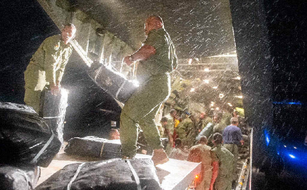 WELCOME HELP: Fijian soldiers unload aid supplies from a New Zealand C-130 Hercules in Suva. WELCOME HELP: Fijian soldiers unload aid supplies from a New Zealand C-130 Hercules in Suva.